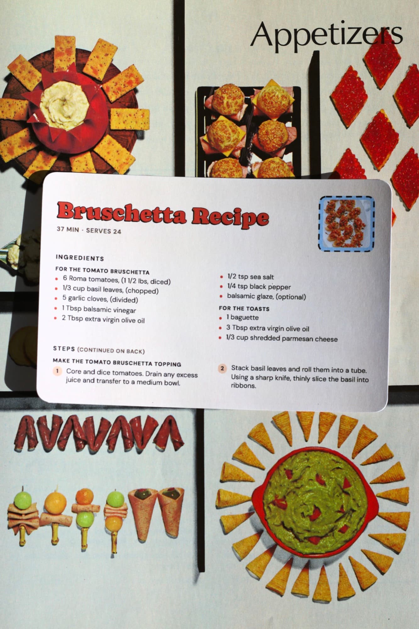 A printed Bruschetta Recipe card laid across a magazine spread of appetizers.